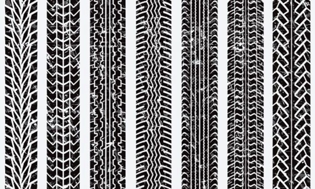 Various black tire tread patterns are displayed for tire services in Calgary, CA.