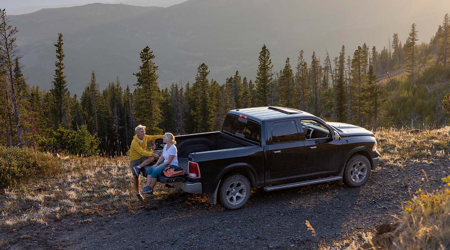 A senior couple rests in a pick-up truck at the Tire Pirates in Calgary, AB.