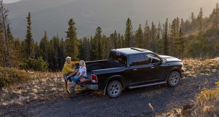 A senior couple rests in a pick-up truck at the Tire Pirates in Calgary, AB.