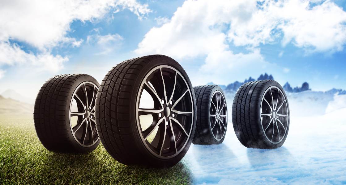Four tires on a field showing Tire Pirates' rim sizes in Calgary's Foothills & Chinook.