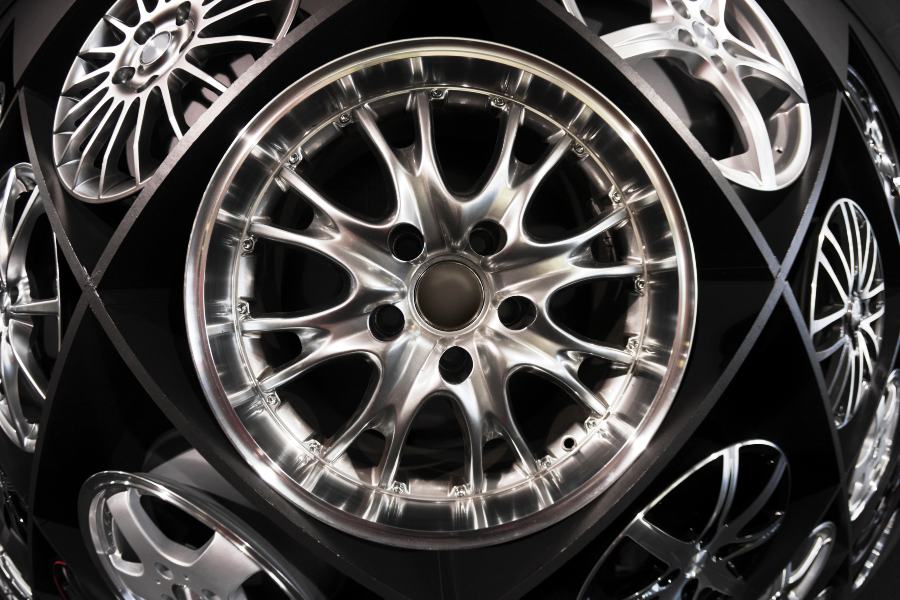Chrome rims displayed at the service center of Tire Pirates in Foothills & Chinook, Calgary