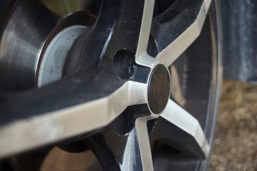 Close-up of a car wheel, highlighting OEM vs. aftermarket wheels in Foothills & Chinook Calgary.