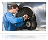 Mechanic changing the break pad of car tyre, Calgary AB